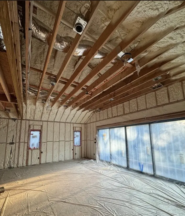 Interior walls and ceiling insulated with spray foam during new construction in Los Lunas